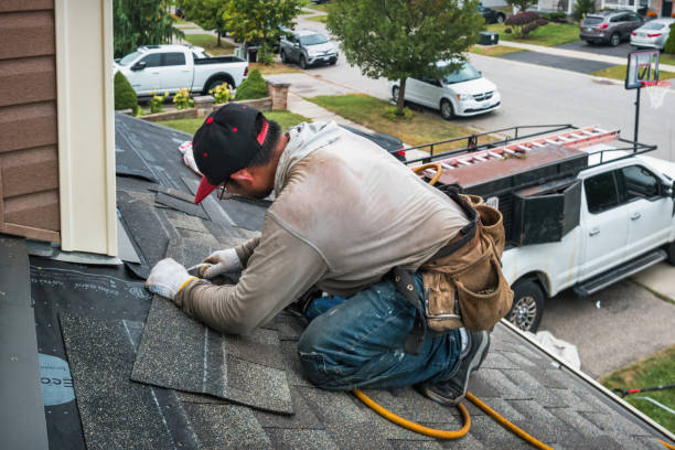 Professional Storm Damage Roof Repair technician working in Rockville Centre, NY